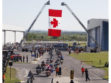 Motorcyclists ride in the Ottawa TELUS Motorcycle Ride for Dad at the Canadian Aviation and Space Museum on Saturday May 31, 2014.