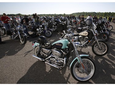 Motorcyclists wait at the start of the Ottawa TELUS Motorcycle Ride for Dad at the Canadian Aviation and Space Museum on Saturday May 31, 2014.