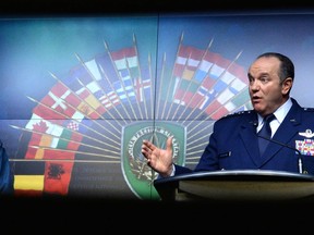 General Tom Lawson, Chief of the Defence Staff, and General Philip Breedlove, Commander of U.S. European Command and NATO Supreme Allied Commander Europe, speak at National Defence Headquarters in Ottawa on Tuesday, May 6, 2014. THE CANADIAN PRESS/Sean Kilpatrick
