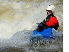 Spring has sprung An avid kayaker coolly attacks the surging rapids at Bate Island.