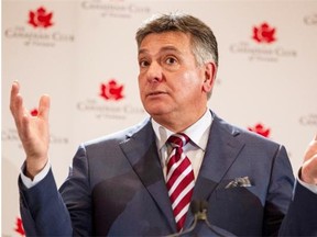 Onatrio's Finance Minister Charles Sousa delivers a speech to business leaders in Toronto on Thursday April 3, 2014. THE CANADIAN PRESS/Chris Young