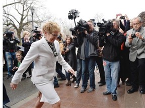 Ontario Premier Kathleen Wynne goes into Lt.-Gov. David Onley's office in Toronto on Friday, May 2, 2014. Ontario Premier Kathleen Wynne will call an election for June 12 instead of waiting to see her minority Liberal government defeated in a confidence vote on its budget. THE CANADIAN PRESS/Frank Gunn