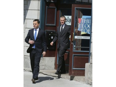 Ontario Progressive Conservative Party leader, Tim Hudak, left, leaves Play Food and Wine restaurant in Ottawa's ByWard Market Thursday May 22, 2014.