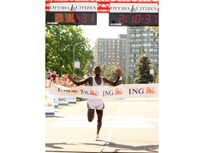 Ottawa-05/28/06-Amos Tirop Matui of Kenya was the first to cross the finish line but was part of the runners that took the short cut in the ING Ottawa Marathon race in Ottawa, Sunday, May 28, 2006. Photo by JEAN LEVAC, THE OTTAWA CITIZEN, CANWEST NEWS SERVICE (For SPORTS section - Martin Cleary ) ASSIGNMENT NUMBER 77272