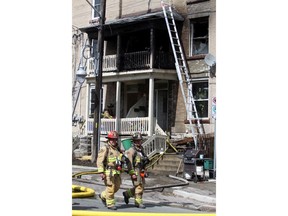 Ottawa firefighters respond to a blaze in an apartment building on Preston, Saturday, May 10, 2014.