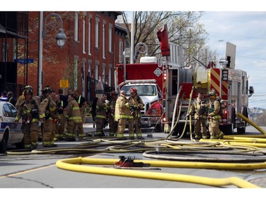 Ottawa firefighters respond to a blaze in an apartment building on Preston, Saturday, May 10, 2014.