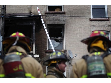 Ottawa firefighters respond to a blaze in an apartment building on Preston, Saturday, May 10, 2014.