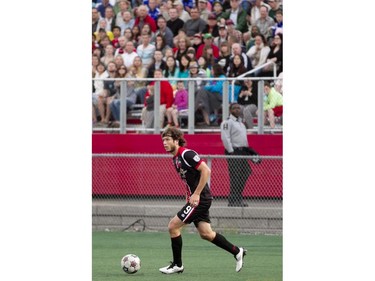 Ottawa Fury striker Tom Heinemann moves the ball up field during the teams match-up at Keith Harris Stadium in Ottawa, May 31, 2014.