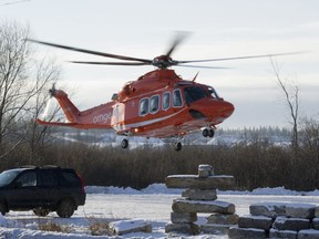 OTTAWA, ON: DECEMBER 21, 2012 -- Police investigate a roll over of a car ina ditch that was submerged this morning at the intersection of March Rd. and Upper Dwyer Hill Rd. in Ottawa, ON, on December 21, 2012. The female driver was in cardiac arrest when an air ambulance transfered the victim to hospital. (For CITY Section)