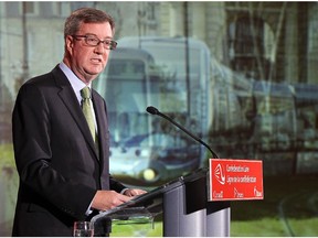 Mayor Jim Watson announces the winning bid for Ottawa's light-rail project. Liberal leader Kathleen Wynne has pledged support to the second phase of the project, while PC leader Tim Hudak has not.