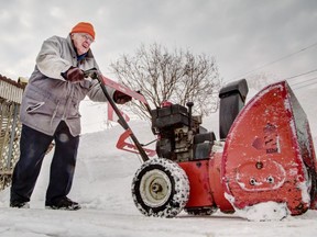 The long, cold winter has left Ottawa looking how it can save costs on snow-clearing in the future. In this photo from February, 82-year-old Allan Hollingsworth plows his own lane way after the snow removal company he hired to do it went out of business.  ( Chris Mikula / Ottawa Citizen) For CITY story Assignment # 116178