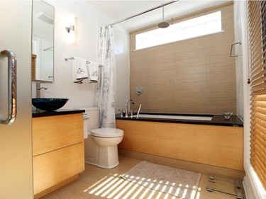 Robert Matthews’ home includes a spacious bathroom with rainwater shower and big soaker tub.
