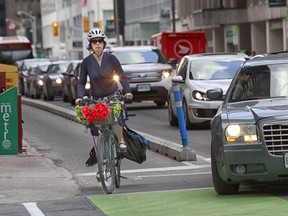 Bike Commuters head home using the Laurier Ave bike lane.