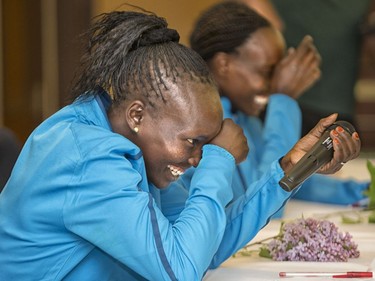 Press conference for the 10K elites. Mary Keitany of Kenya stifles a laugh after mistakenly inviting everyone out for the races on the wrong day.