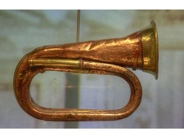 Bugle used to summon First Class passengers to dinner. recovered from  the 'Empress of Ireland' on exhibit at the Canadian Museum of History.