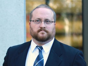 Clinton Russell leaves the the Elgin St. courthouse during his sexual assault trial in Ottawa in October 2013.