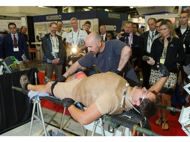 Patrick Papineau demonstrates some of the life saving medical techniques taught by Strategic Operations Tactical Training as the annual trade fair for military equipment known as CANSEC took place at the EY Centre near the airport.