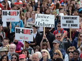 People take part in the March For Life on Parliament Hill on Thursday.