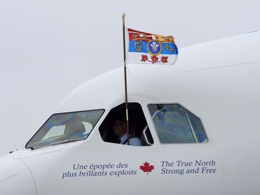 A pilot flies The Prince of Wales' Canadian standard as Charles and the Duchess of Cornwall land on Sunday, May 18, 2014 in Halifax. The Royal couple begin a four-day tour of Canada.