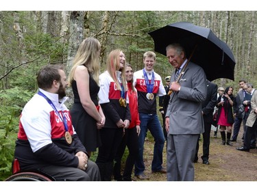 Prince Charles is greeted by Olympic, Paralympic and Commonwealth game athletes in Bonshaw Provincial Park, P.E.I. on Tuesday, May 20, 2014.