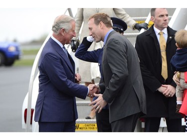 Prince Charles is greeted by Justice Minister Peter MacKay in Halifax Sunday, May 18, 2014. The Royal couple begin a four-day tour of Canada.