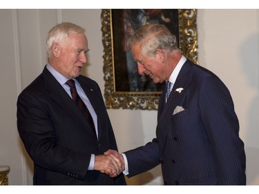 Prince Charles Governor is congratulated by General David Johnston after being as a member of the Privy Council in Halifax on Sunday, May 18, 2014. The Royal couple begin a four-day tour of Canada.