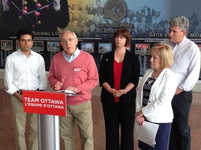 Provincial Liberal candidates Yasir Naqvi, Bob Chiarelli, Marie-France Lalonde, Madeleine Meilleur and John Fraser react to the NDP platform Friday morning at Ottawa city hall.  For 0524 liberals