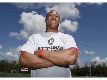Quarterback Henry Burris speaks to reporters at the CFL Ottawa Redblacks rookie camp at Keith Harris Stadium in Ottawa on Friday May 30, 2014.