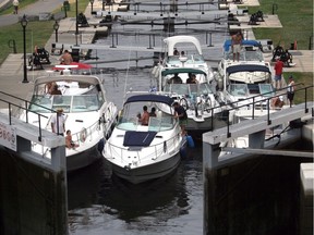 Pleasure boats lock through at the entrance to the Rideau Canal in Ottawa.