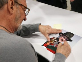 Robert Englund, aka Freddy, signs an autograph on the opening day of Comiccon in Ottawa, May 09, 2014.