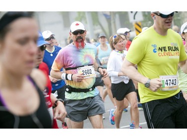 Roger Coles has a colourful approach to his marathon run during Ottawa Race Weekend Sunday May 25, 2014.