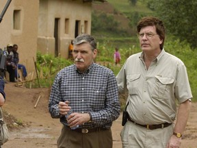 Roméo Dallaire and Peter Raymont walk together in Rwanda while filming the Canadian documentary Shake Hands With the Devil.