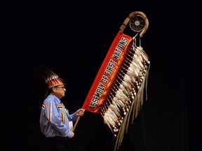 Chief Rufus Copage of Shubenacadie First Nations, N.S., carries the Assembly of First Nations Eagle Staff during the grand entry as First Nations leaders, elders, youth and delegates gather for the Assembly of First Nations Special Chiefs Assembly in Ottawa Tuesday.