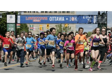 Runners participate in the 2k run during the Ottawa Race Weekend on Saturday May 24, 2014.