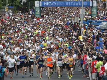 Runners participate in the 5k run during the Ottawa Race Weekend on Saturday May 24, 2014.