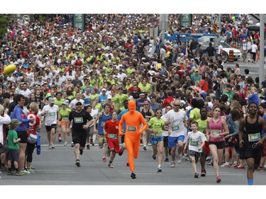 Runners participate in the 5k run during the Ottawa Race Weekend on Saturday May 24, 2014.