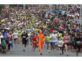 Runners participate in the 5k run during the Ottawa Race Weekend on Saturday May 24, 2014. (Patrick Doyle / Ottawa Citizen)  ORG XMIT: 0526 ottawa10k13