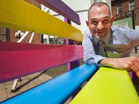 Sabastien Provost, the festival creator, checks out one of the colourful park benches that will be part of a new street festival, Glowfair, featuring a mix of music, light and art to be held June 20-21 along Bank Street.