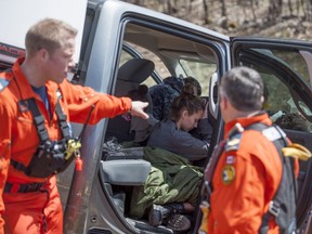 Search and rescue technicians (SAR techs) attend to casualties, played by actors, during Tigerex 2014 at Mont Cascades Ski Resort in Cantley, Que. on Tuesday, May 6, 2014.