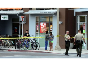 Two women view one of the nine crime scenes where a man went on a killing rampage at the University of California at Santa Barbara college town of Isla Vista, California, USA, 24 May 2014. The suspect killed six people and wounded seven as he drove through the college town shooting as well as running over victims in his car before he died either in the shoot-out with police or from a self-inflicted wound.  New reports indicate the shooter was specifically targeting females.