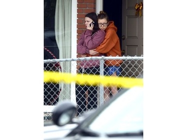 Two women view one of the nine crime scenes where a man went on a killing rampage at the University of California at Santa Barbara college town of Isla Vista, California, USA, 24 May 2014.  The suspect killed six people and wounded seven as he drove through the college town shooting as well as running over victims in his car before he died either in the shoot-out with police or from a self-inflicted wound.