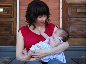 Singer songwriter Jill Zmud with her six week old baby, Violet. Zmud is about to launch a new CD. 
Cole Burston/Ottawa Citizen