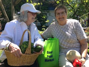 Jane Breen and Hilkka Backa shopped Saturday at a pop-up produce market held in a community garden at Nanny Goat Hill at the corner of Bronson Avenue and Laurier Avenue.