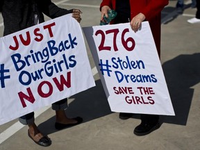 South Africans protest in solidarity against the abduction three weeks ago of hundreds of schoolgirls in Nigeria by the Muslim extremist group Boko Haram and what protesters said was the failure of the Nigerian government and international community to rescue them, during a march to the Nigerian Consulate in Johannesburg, South Africa Thursday, May 8, 2014. The kidnapping has ignited a viral social media campaign that has brought renewed attention to Boko Haram's campaign of violence, and protests around the world. (AP Photo/Ben Curtis)