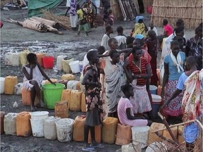 A grab made from a video released by the United Nations Mission in South Sudan (UNMISS) on April 23, 2014 shows displaced people gathering water at a camp in Bentiu, on April 22, 2014.