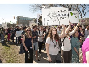 Members of a student-led organization called "TransformThis" march to a rally against the administration of the University of Saskatchewan on campus in Saskatoon,Tuesday,May 20,2014.