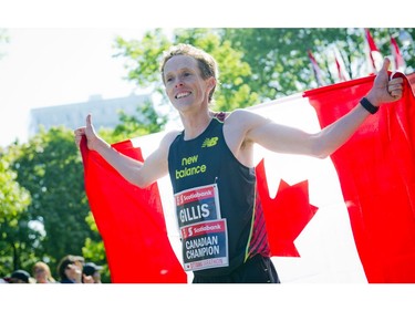 The Canadian Champion Eric Gillis stands in front of the the media after finishing the marathon at Ottawa Race Weekend Sunday May 25, 2014.