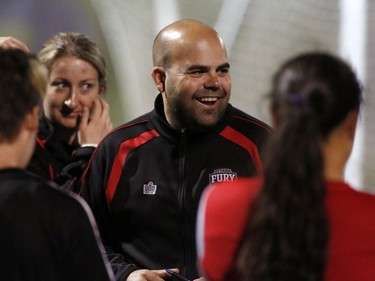 In this file photo, the Ottawa Fury FC women's soccer team coach Dom Oliveri talks to players at the team's practice at Algonquin College in Ottawa on Thursday May 22, 2014.