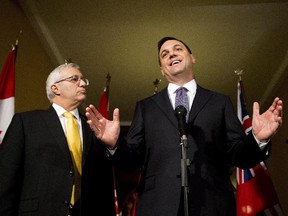 Conservative finance critic Vic Fedeli, left, with Tory leader Tim Hudak in this April 7 file photo.