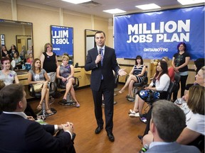 Ontario PC Leader Tim Hudak holds a town hall meeting in a hair salon in Pickering, Ontario on Tuesday May 27.